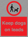 dogs-on-lead-symbol-with-black-text-on-white-background~